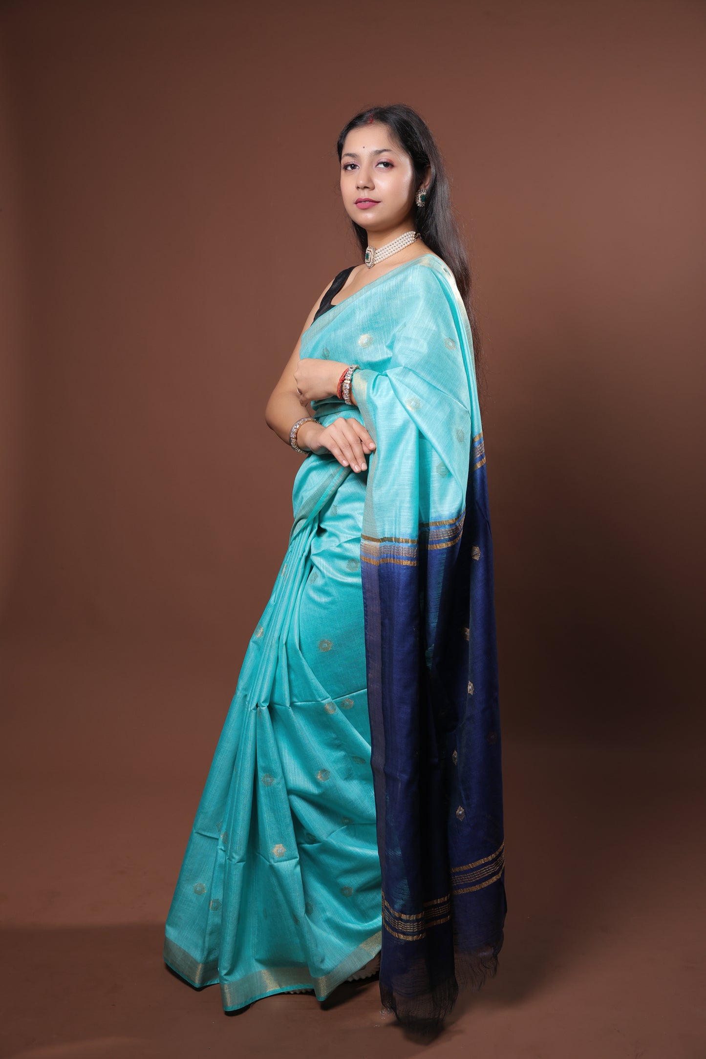 Blue color turquoise saree with golden zari
