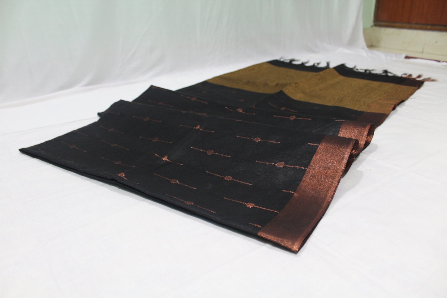 Black Saree with gold border and gold patches