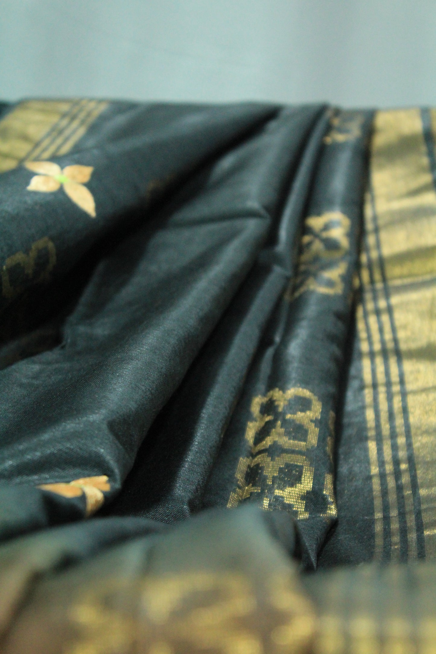 Embroidered black and brown with gold pattern & border saree