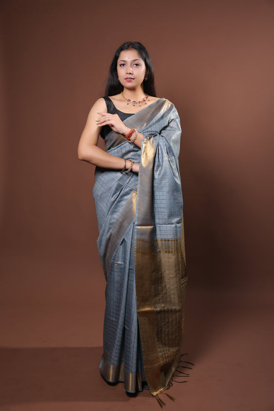 gray and gold saree with a solid  golder zari pattern on border and pallu