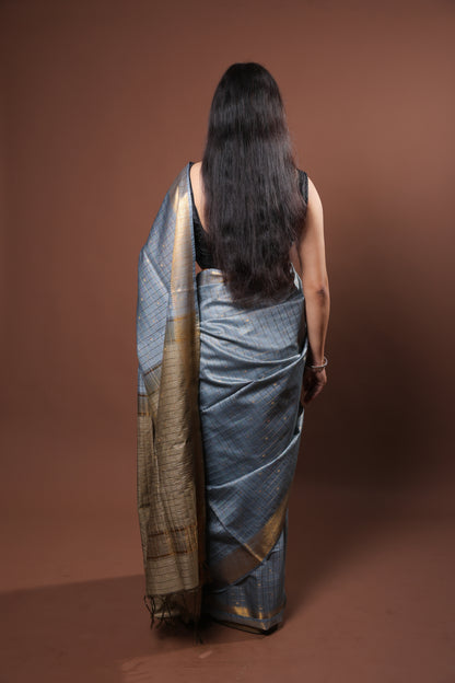 gray and gold saree with a solid  golder zari pattern on border and pallu