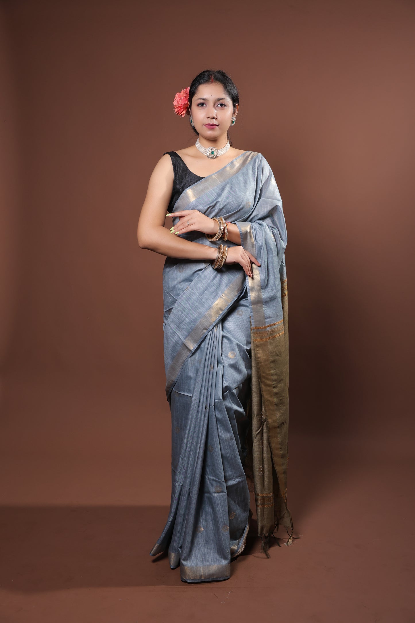 gray and gold saree with a solid  golder zari pattern on border and pallu