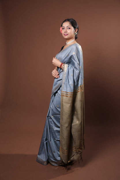 gray and gold saree with a solid  golder zari pattern on border and pallu