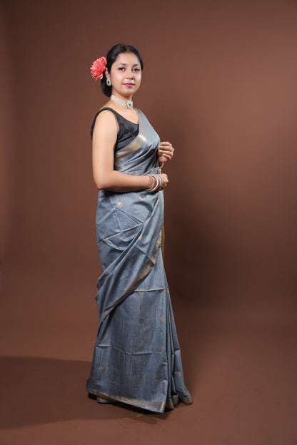 gray and gold saree with a solid  golder zari pattern on border and pallu