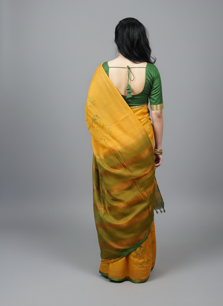 Embroidered gold color festive wear saree with green threaded work