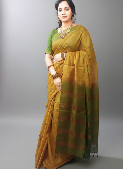 Embroidered gold color festive wear saree with green threaded work