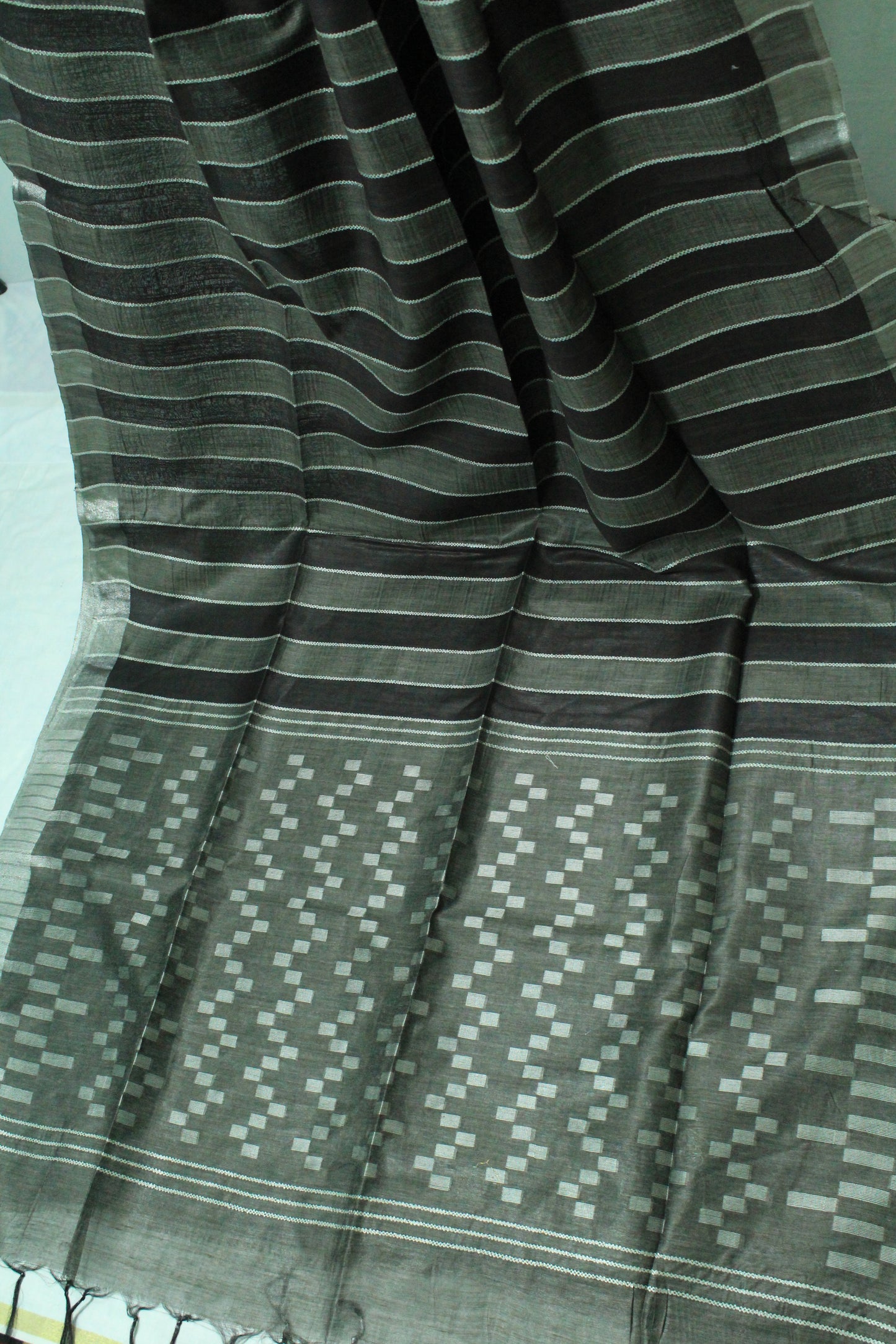 Staple body silver border black color silk Saree