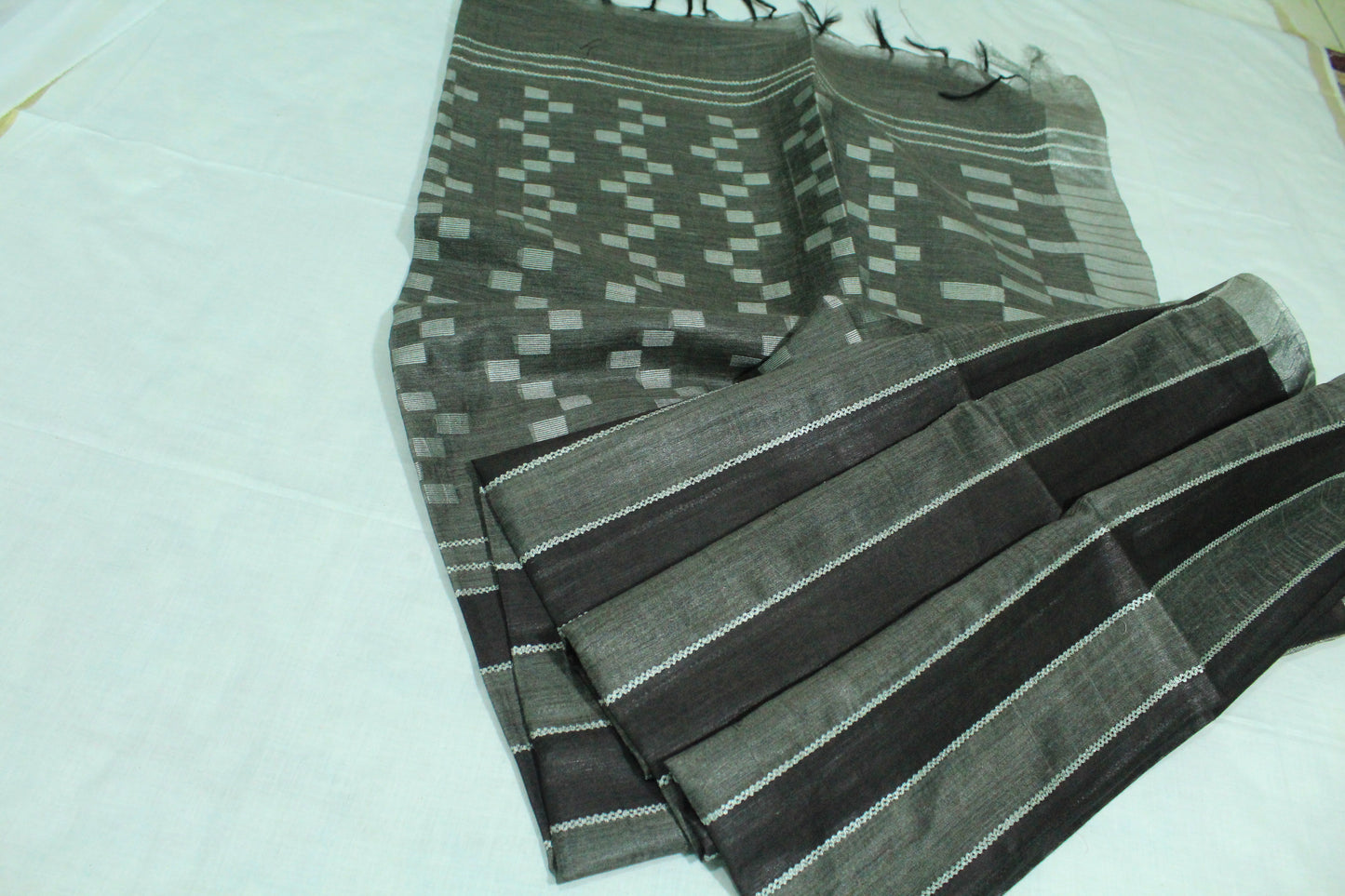 Staple body silver border black color silk Saree