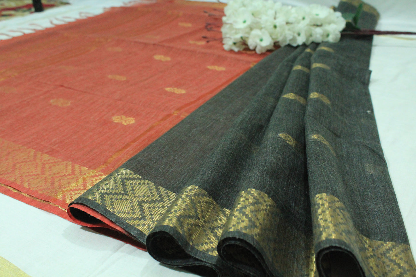 Golden zari buta border silk festive wear black and red color Saree