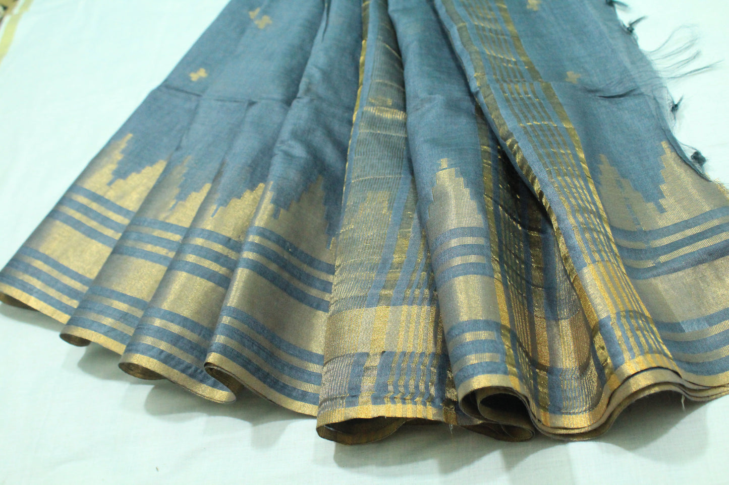 Golden zari buta temple border Silk Saree in rich grey color