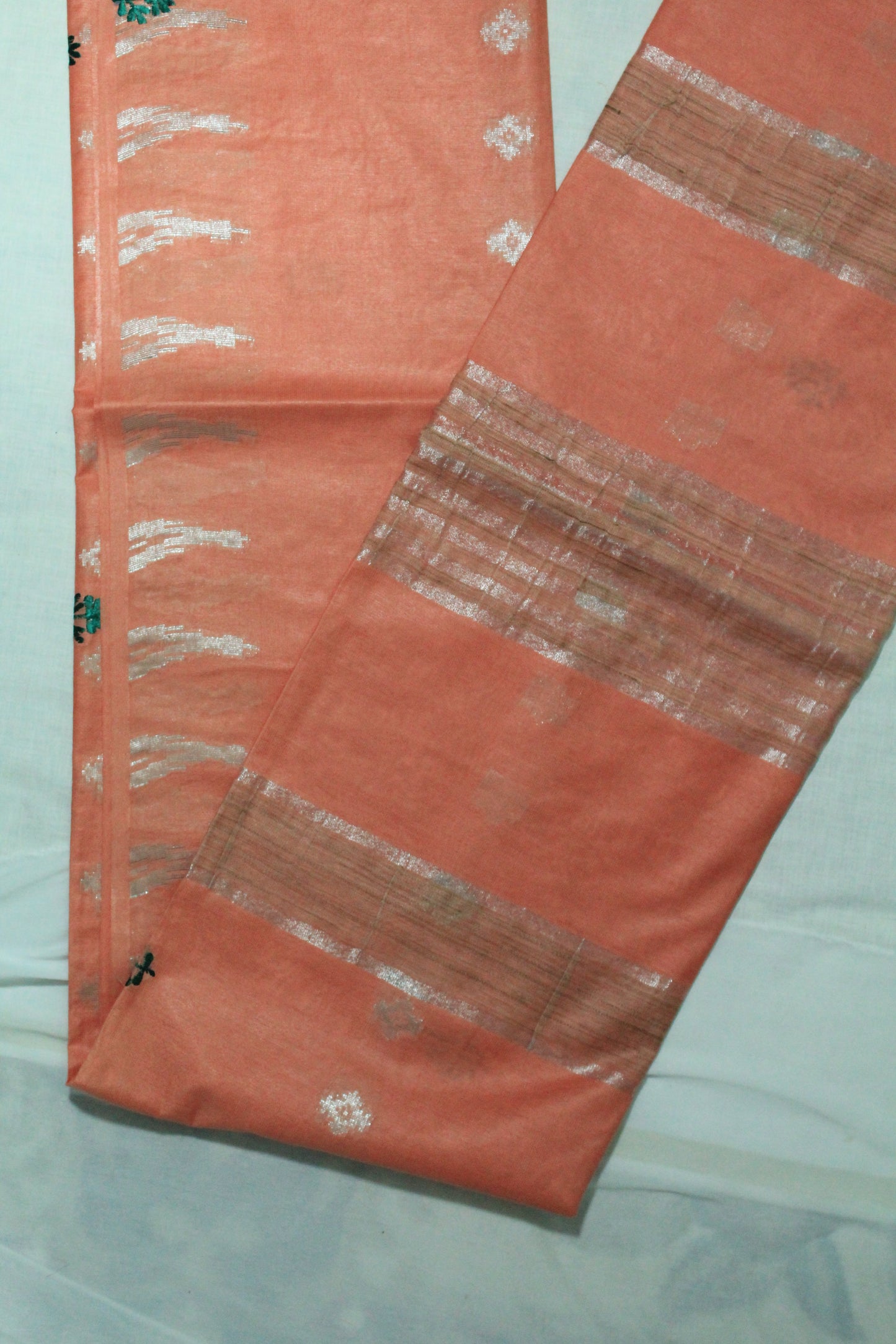 Embroidery saree with beautiful silver zari in light orange color