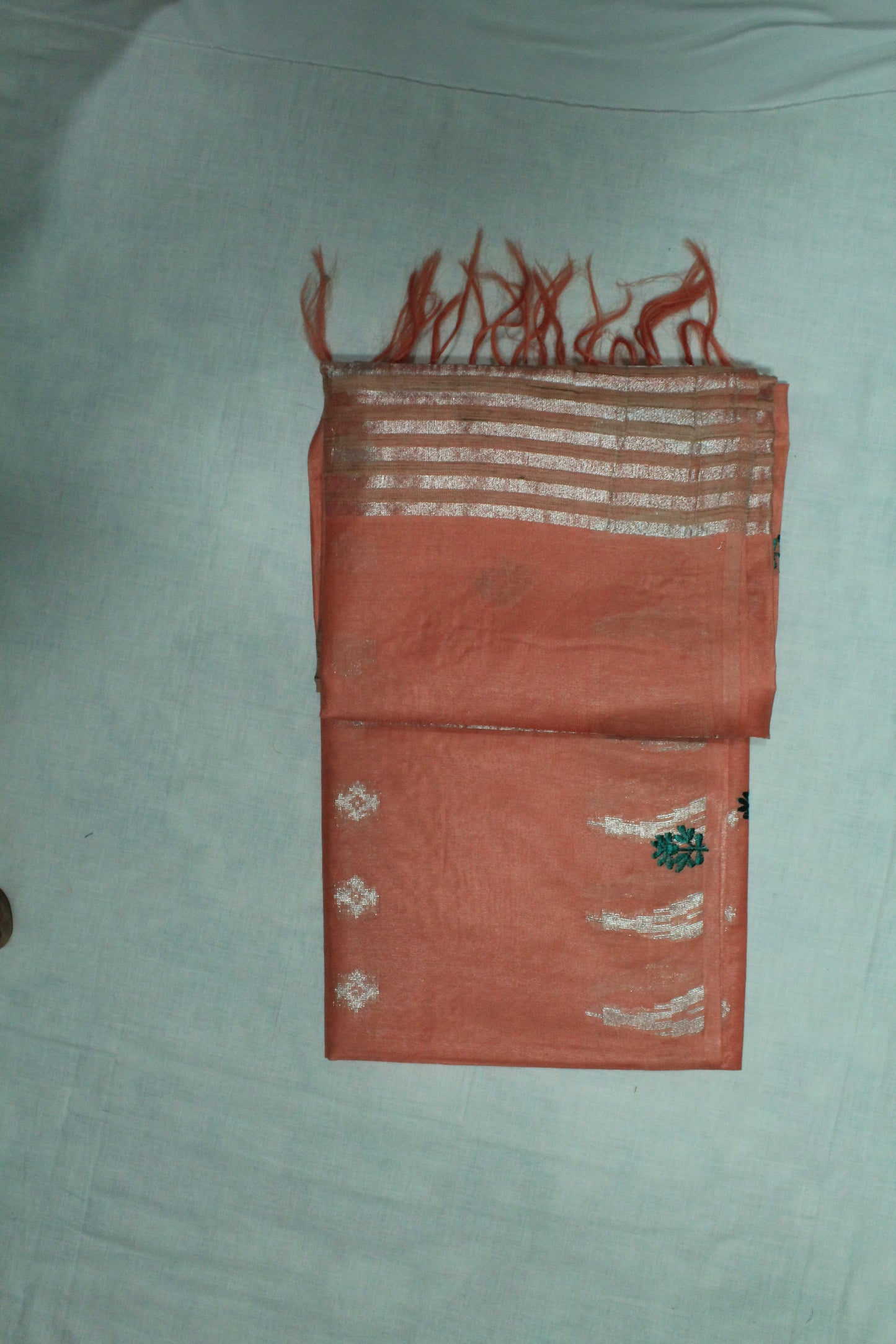 Embroidery saree with beautiful silver zari in light orange color