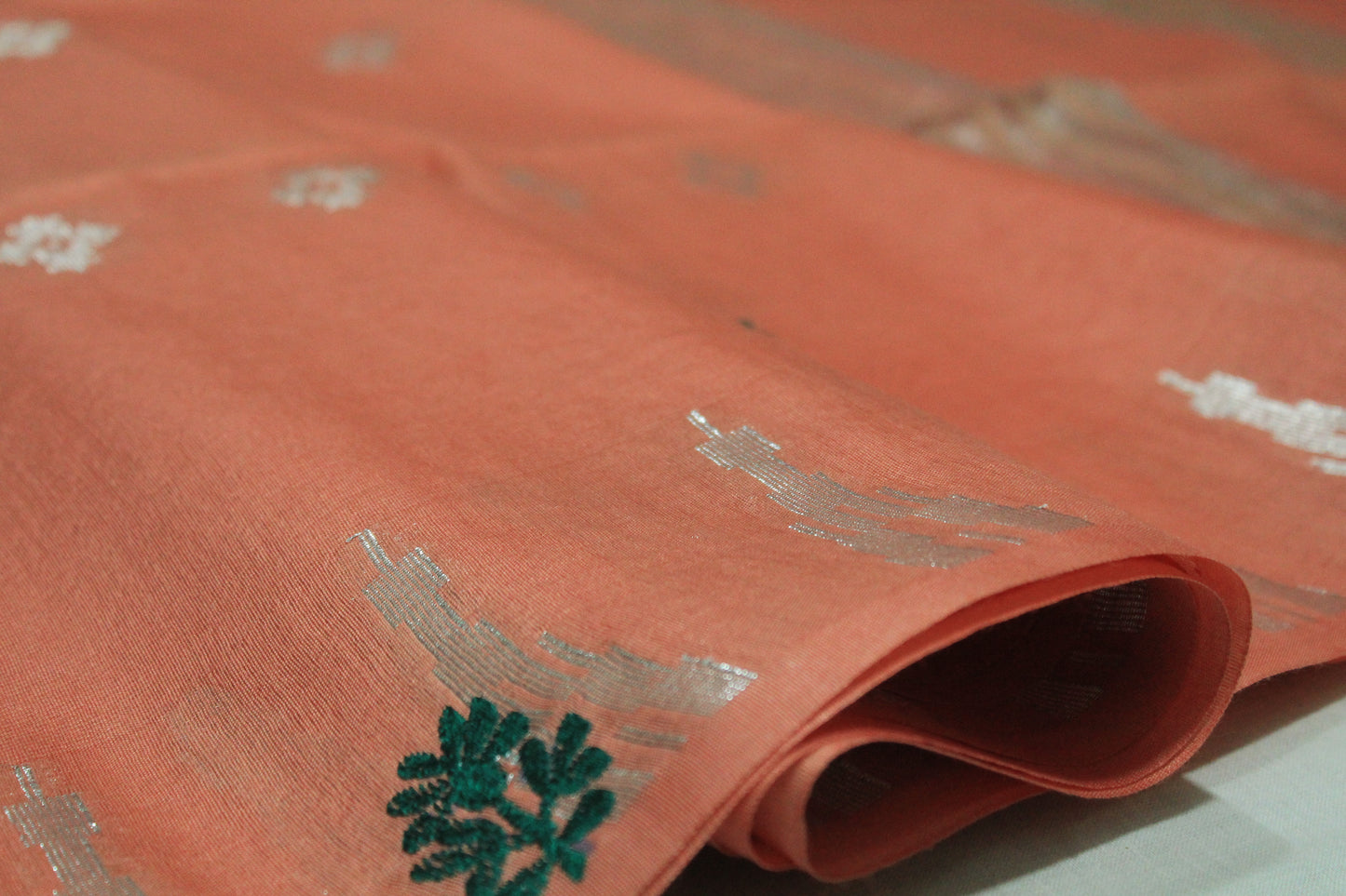 Embroidery saree with beautiful silver zari in light orange color