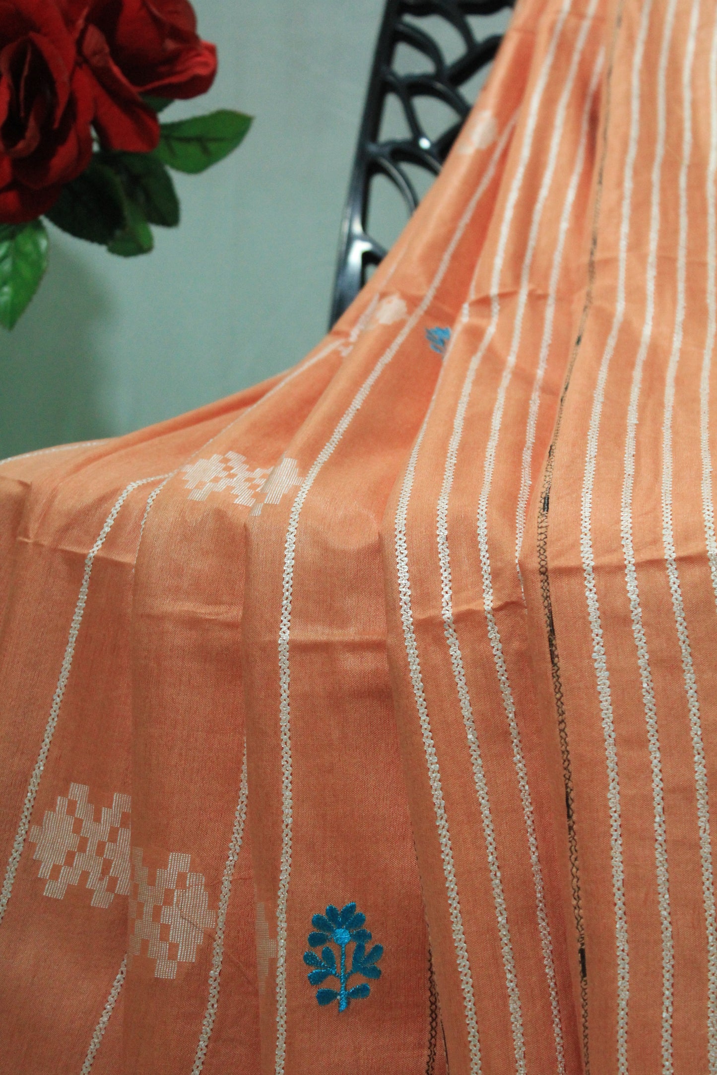 embroidered orange color saree with white pattern