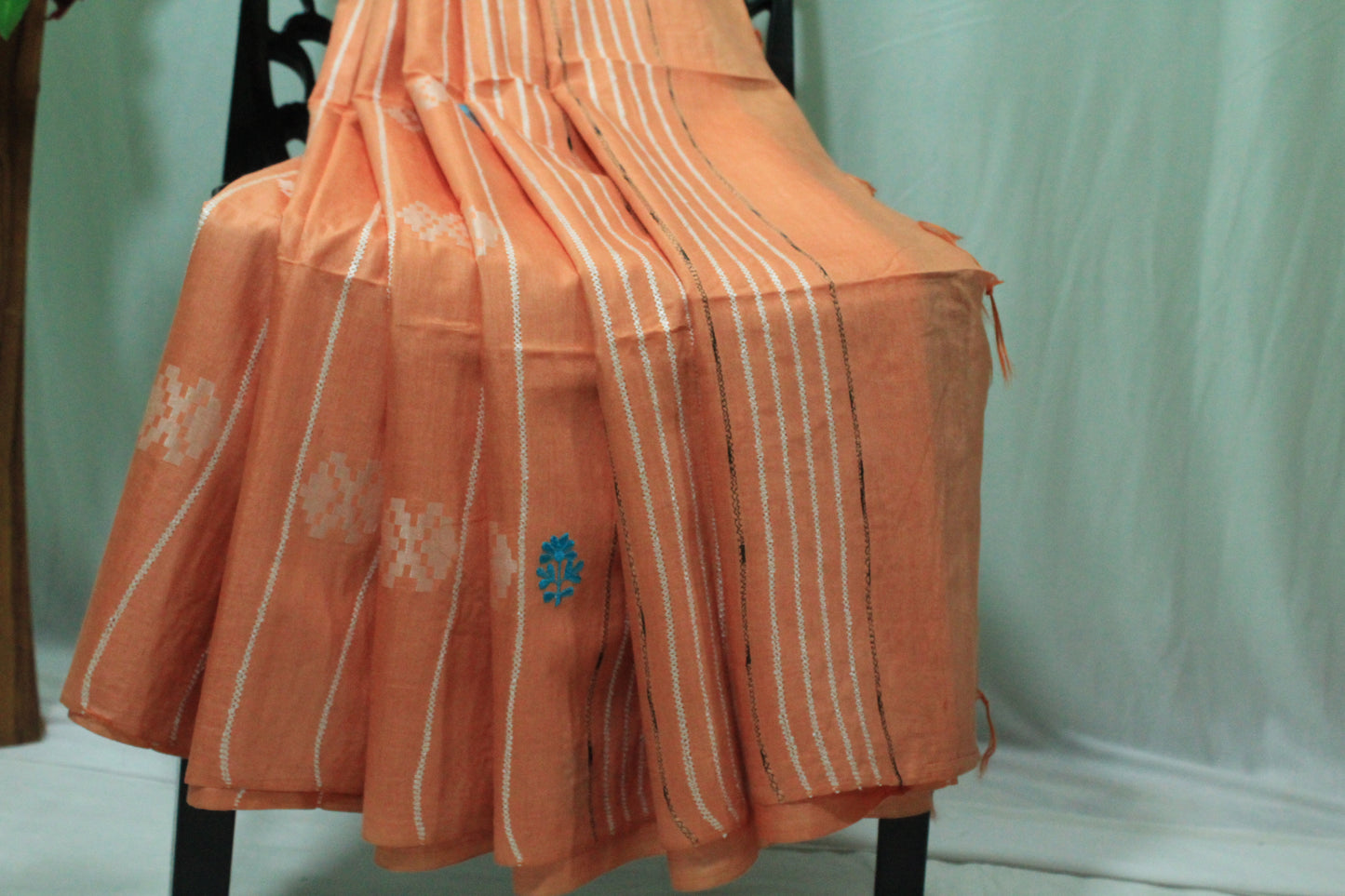 embroidered orange color saree with white pattern