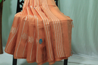 embroidered orange color saree with white pattern
