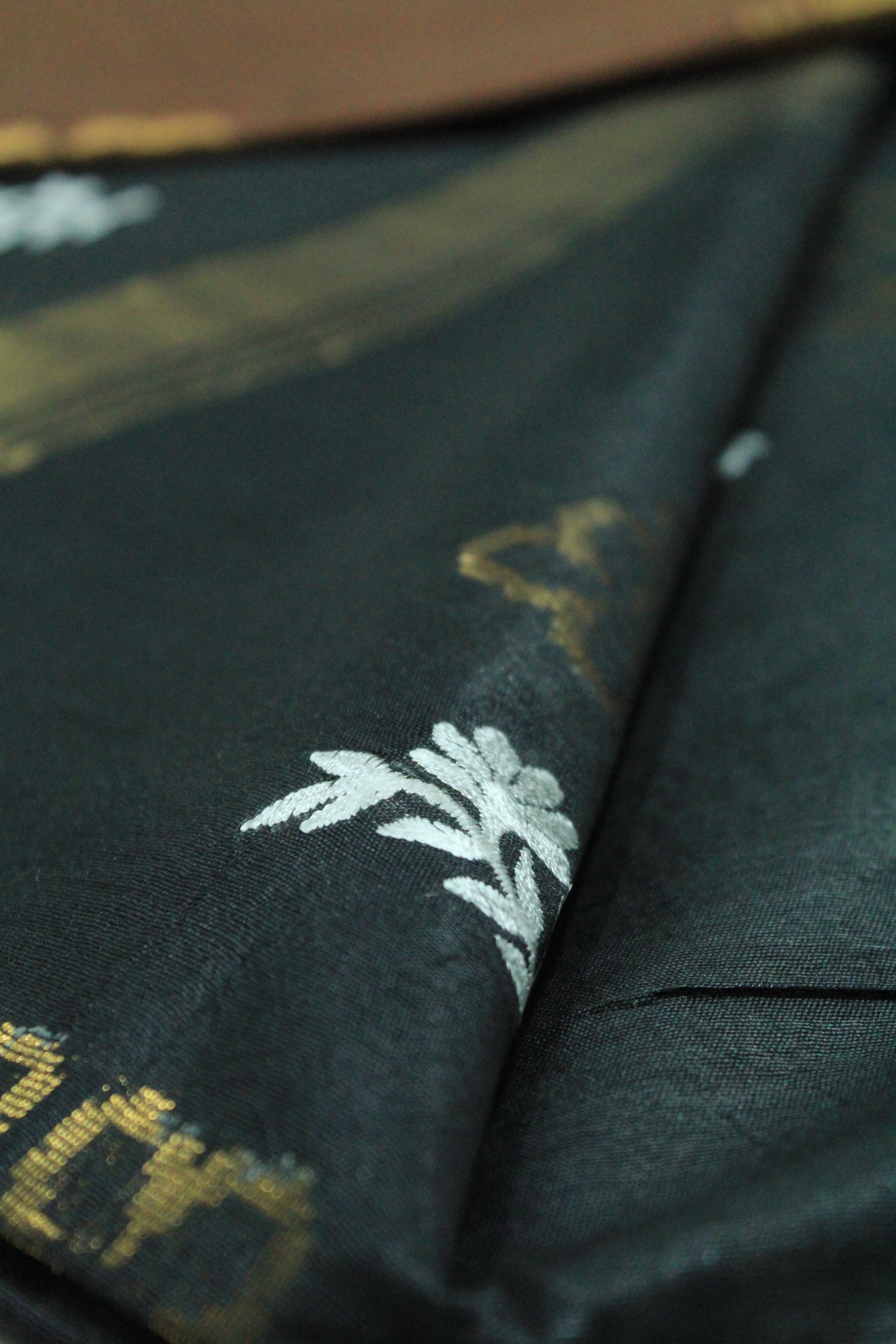 Plain work wear black saree with embroidery and gold pattern