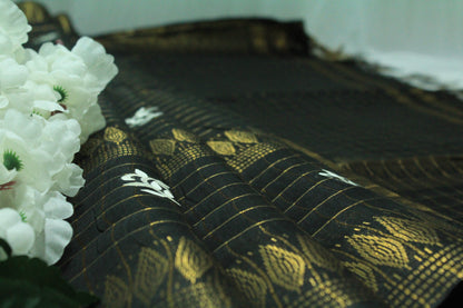 Embroidered with zari checkered black color saree
