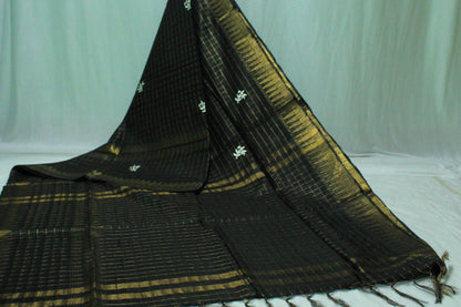 Embroidered with zari checkered black color saree