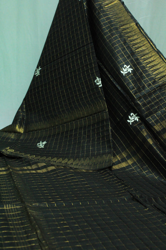 Embroidered with zari checkered black color saree