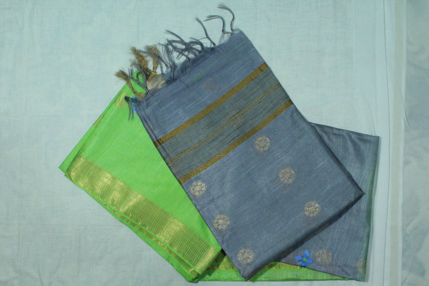Emboidered green saree with gold patterns