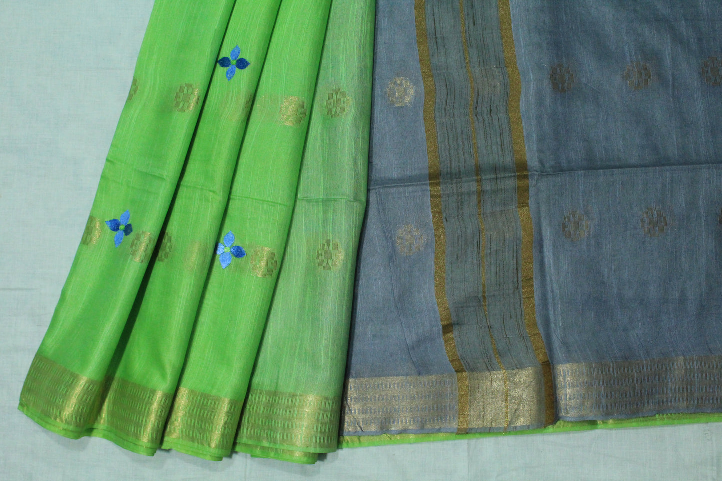 Emboidered green saree with gold patterns