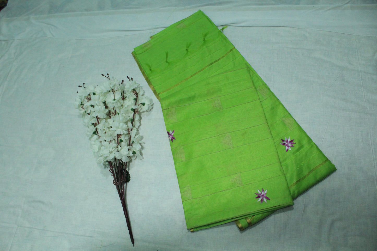 Plain green color saree  with embroidered pattern