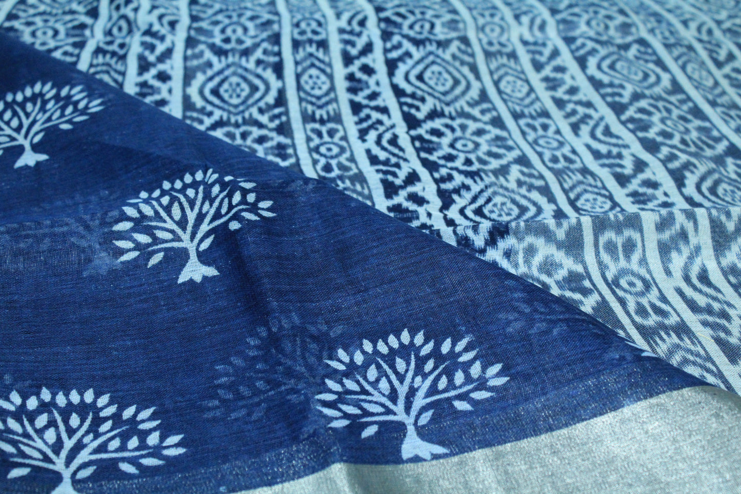 Blue color linen saree with floral print in white pattern