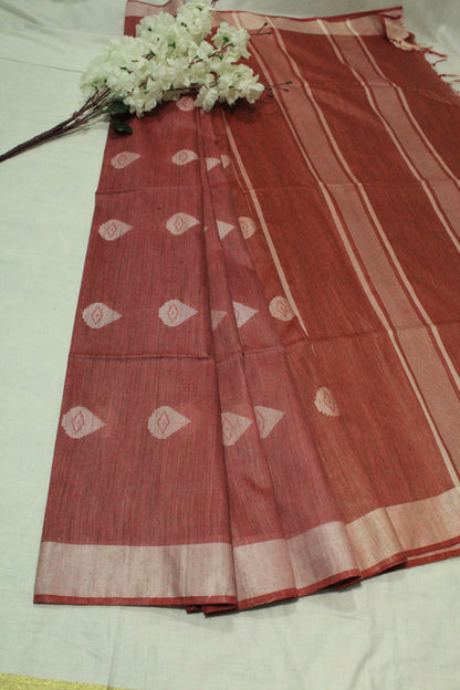 Red saree with white patterns in Silk fabric